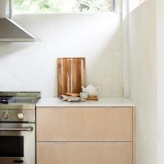 Modern Kitchen With Wood Cutting Board