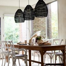 Neutral Country Dining Room With Black Pendants