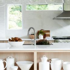 Open Kitchen With White Dishes