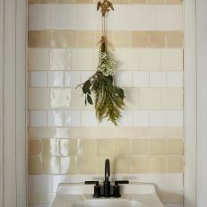 Bathroom Sink With Beige Tile Backsplash