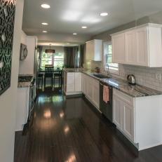 Contemporary White Kitchen with Hardwood Brown Floor