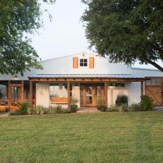 White Farmhouse Exterior with Neutral Screened Porch and Garage 