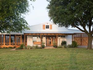 White Farmhouse Exterior with Neutral Screened Porch and Garage 