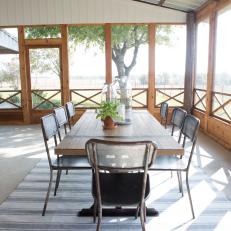 Brown Country Screened-In Porch with Brown Wood Dining Table
