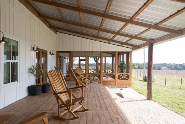 Neutral Porch with Several Brown Rocking Chairs 