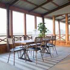 Brown Country Screened Porch with Outdoor Dining Area 