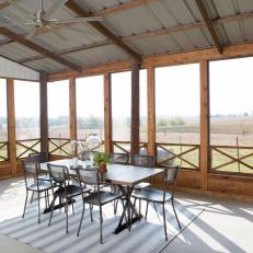 Brown Country Screened Porch with Gray Ceiling Fan 