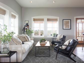 Neutral Living Room w Large White Windows, Gray Rug and Brown Floors