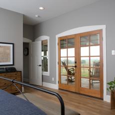 Neutral Contemporary Master Bedroom with Brown French Doors 