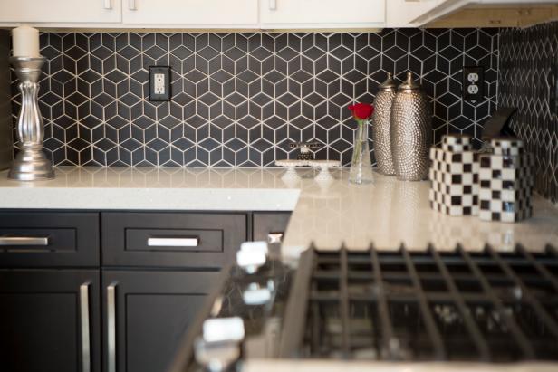 The high contrast in the backsplash helps to separate the whites In the countertops and the cabnets. As seen on Flip or Flop Vegas. (after, interior)