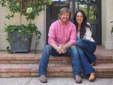 As seen on Fixer Upper, Chip and Joanna Gaines outside the Morrison's rennovated house. (Portrait)