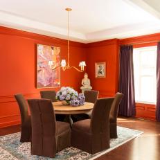 Red Eclectic Dining Room With Brown Chairs