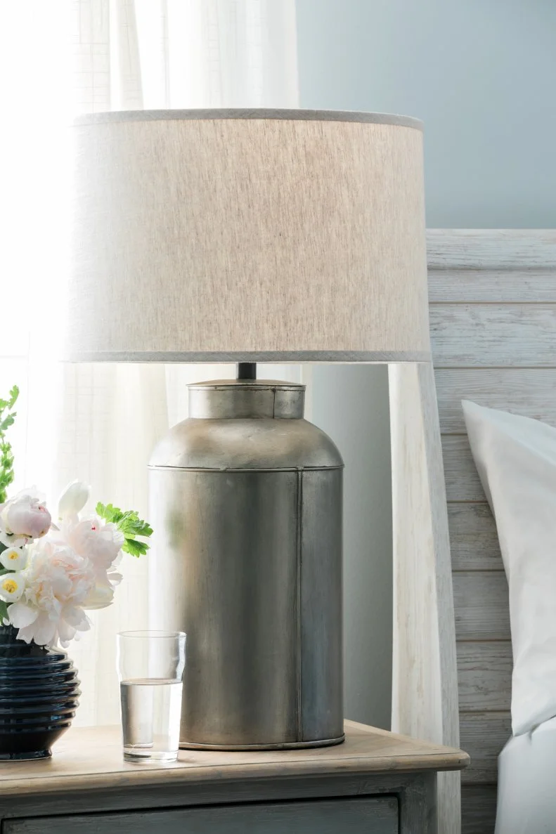 There’s no rule that says you need matching lamps! Unify different lamps by choosing similar heights and the same style/color shade. Also, for a cozy, boutique hotel vibe, put lamps on dimmers.