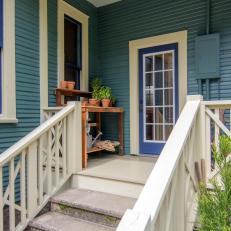 Blue Back Porch with White Stairs and Railing