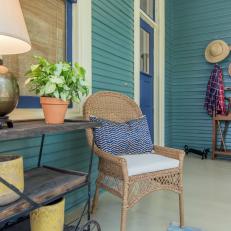 Rustic Blue Front Porch with Neutral Wicker Chair 