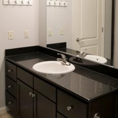 Before: Master Bathroom with Black Countertops 