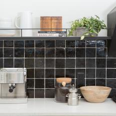 Modern Black and White Kitchen with Black Tile Backsplash and white Countertop