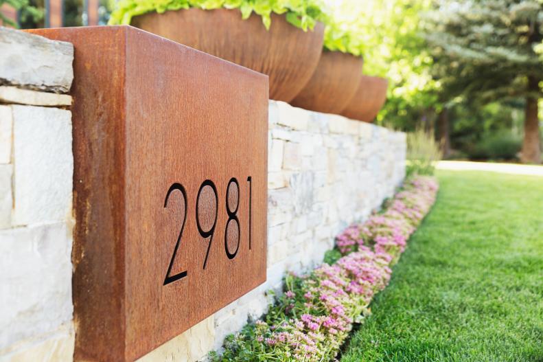 retaining wall with contemporary address numbers