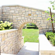 Arch Offers Glimpse of Garden