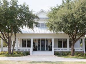 White Farmhouse Exterior with Brown Brick Skirt