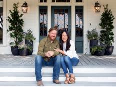 As seen on Fixer Upper, Chip and Joanna Gaines outside the Ramsey's renovated home. (Portrait)