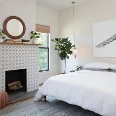 Contemporary White Master Bedroom with Gray and White Fireplace  