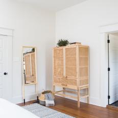 Contemporary White Master Bedroom with Neutral Wicker Armoire 