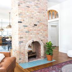 Contemporary Neutral Open Concept Dining and Sitting Room with Brick Fireplace 