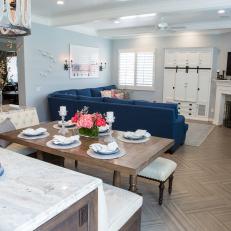 Blue Kitchen & Family Room With Dining Table