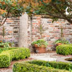 Formal Garden With Brick Wall