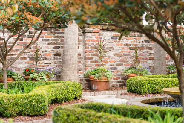 Formal Garden With Brick Wall | HGTV