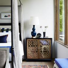Black Nightstand and Blue Lamp