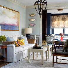 Blue Transitional Sitting Room With Yellow Pillow