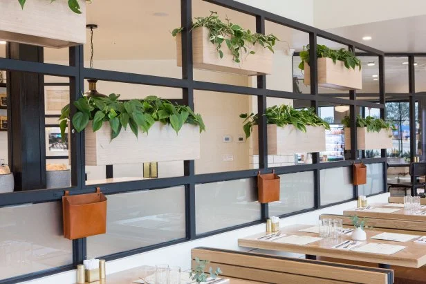 Black and White  Dining Room with Neutral Wood Planters 