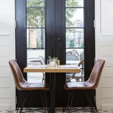 Contemporary Black and White Dining Room with Brown Table and Chairs 