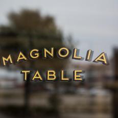 Golden Magnolia Table Window Logo