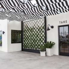 Contemporary Black and White Take-Away Entrance with Black Door 