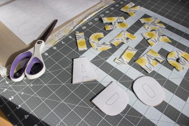 Use cardboard and fabric to make pretty ABC magnet letters.