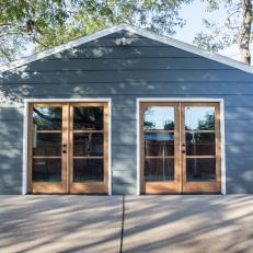 Rustic Blue Garage-Turned-Studio with Neutral French Doors 