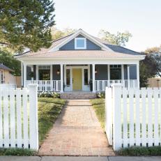 Contemporary Gray Home Exterior with White Picket Fence