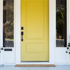Yellow Front Door on Contemporary Gray Home Exterior 