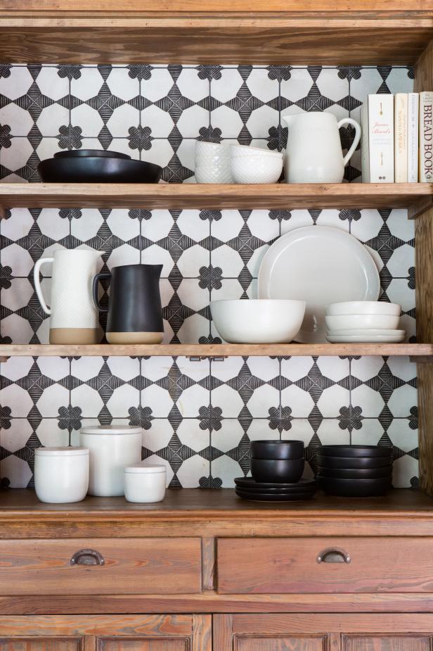 Black and White Tile in Brown Cabinet and Black and White Dinnerware
