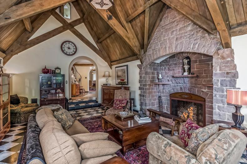 traditional great room with brick fireplace