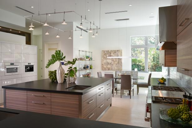 Brown and Black Kitchen Island With Metal Track Lighting