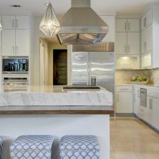 White Chef Kitchen With Blue Stools