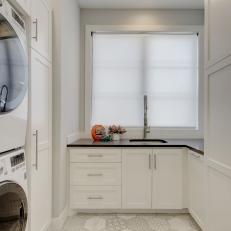 White Laundry Room With Patchwork Floor