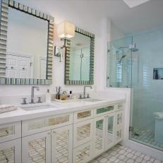 White Master Bathroom With Mirrored Vanity