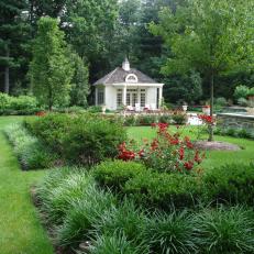 Formal Garden With Red Flowers