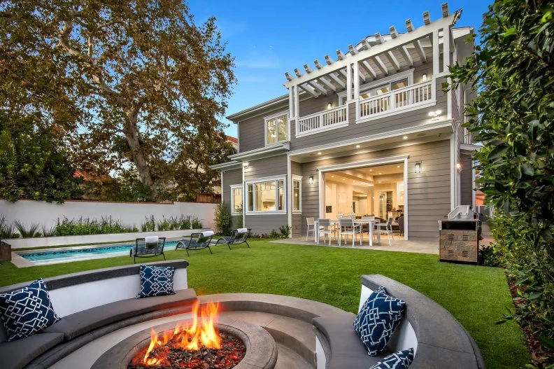 traditional backyard with pool and fire pit
