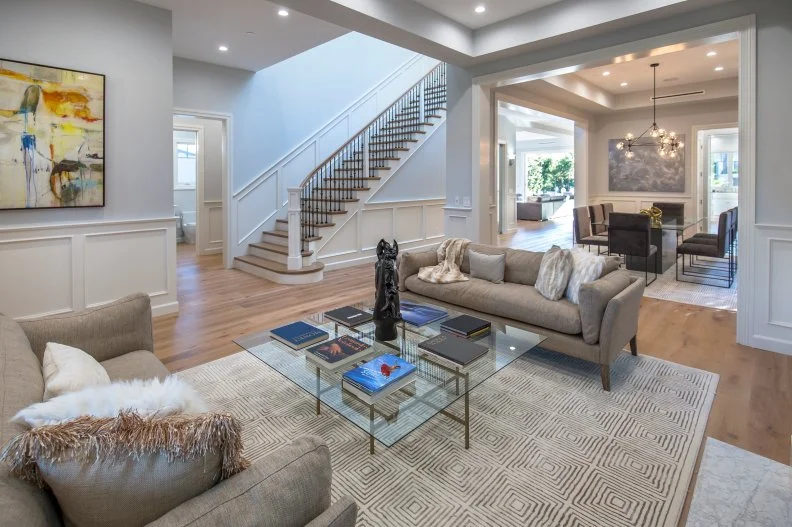transitional living room with gray sofas